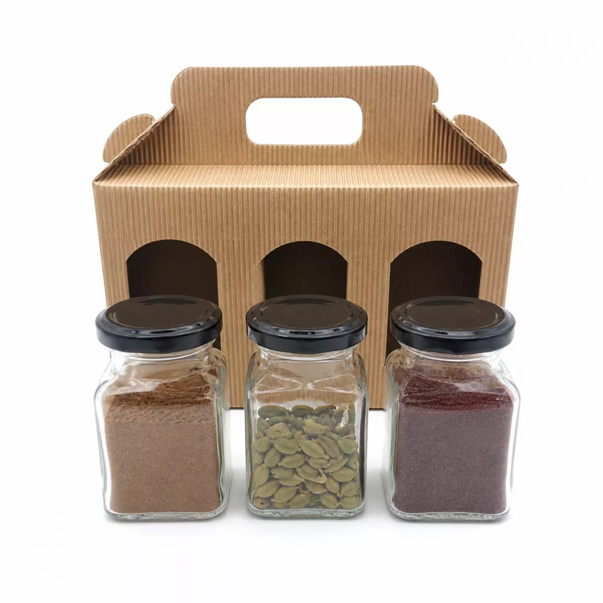 Geschenkbox mit Tragegriff und drei Bogenfenstern, Inhalt: Baharat, grüner Kardamom und Sumach von Charaf Gewürze Berlin